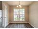Bright dining area with hardwood floors and large windows offering plenty of natural light at 1851 Grove Way, Hampton, GA 30228