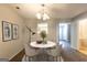 Cozy dining area featuring a chandelier, round table, and stylish decor at 1851 Grove Way, Hampton, GA 30228