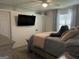 Comfortable bedroom with a ceiling fan and large wall-mounted television at 401 Bainbridge Dr, Mcdonough, GA 30253