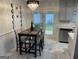 Stylish dining area with modern lighting and backyard view at 401 Bainbridge Dr, Mcdonough, GA 30253