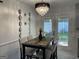 Elegant dining room with stylish chandelier and patio door access at 401 Bainbridge Dr, Mcdonough, GA 30253