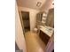 Bathroom with a toilet, vanity, mirror and medicine cabinet provides essential amenities in a compact space at 2884 Mountbery Dr, Snellville, GA 30039