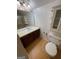 A bathroom featuring a vanity, mirror, toilet, and built-in storage at 2884 Mountbery Dr, Snellville, GA 30039