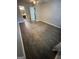 Bedroom showcasing wood-look floors, neutral walls, and access to an ensuite bathroom and closet at 2884 Mountbery Dr, Snellville, GA 30039