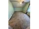Bedroom with wall-to-wall carpeting, a window and a ceiling fan, creating a welcoming atmosphere at 2884 Mountbery Dr, Snellville, GA 30039