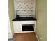 Charming built-in shelves with decorative wallpaper, providing ample storage space at 2884 Mountbery Dr, Snellville, GA 30039