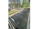 A wooden deck overlooking a spacious backyard with wooden fence at 2884 Mountbery Dr, Snellville, GA 30039