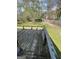 A wooden deck overlooking a fenced yard, perfect for relaxation or entertainment at 2884 Mountbery Dr, Snellville, GA 30039