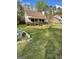 Charming home with a well-maintained front yard, stone accents, and a cozy front porch at 2884 Mountbery Dr, Snellville, GA 30039