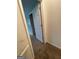 Hallway with carpet flooring leads to other rooms, offering seamless transitions within the home's layout at 2884 Mountbery Dr, Snellville, GA 30039