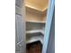 Walk-in pantry features built-in shelving at 2884 Mountbery Dr, Snellville, GA 30039