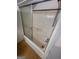 A tub and shower combination with sliding glass door at 2884 Mountbery Dr, Snellville, GA 30039