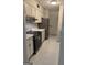 The kitchen is equipped with modern appliances and freshly painted white cabinets at 2968 Par Lorraine, Lithonia, GA 30038