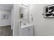 Modern bathroom vanity offers updated faucet, neutral paint, and minimalist framed mirror at 389 Oglesby Bridge, Conyers, GA 30094