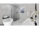 Bright bathroom with soaking tub, shower, and stylish fixtures and modern finishes at 389 Oglesby Bridge, Conyers, GA 30094