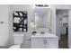 Modern bathroom featuring a vanity, mirror, decor, and tiled walls at 389 Oglesby Bridge, Conyers, GA 30094