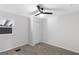 Bright bedroom offers soft carpet, a ceiling fan, and a window bringing natural light at 389 Oglesby Bridge, Conyers, GA 30094