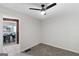 Cozy room features new carpet, ceiling fan, and an open doorway view to dining area at 389 Oglesby Bridge, Conyers, GA 30094
