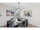 Dining area featuring modern light fixture and gray dining set at 389 Oglesby Bridge, Conyers, GA 30094