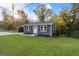 Well-maintained exterior with a spacious yard and modern color scheme at 389 Oglesby Bridge, Conyers, GA 30094