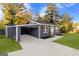 Stylish exterior with carport, freshly painted siding, and new landscaping at 389 Oglesby Bridge, Conyers, GA 30094