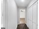 Hallway with wood floors leading to a bedroom with a ceiling fan at 389 Oglesby Bridge, Conyers, GA 30094