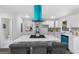 Modern kitchen with island, stainless steel appliances, and custom range hood at 389 Oglesby Bridge, Conyers, GA 30094