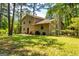 Backyard featuring a grassy area and mature trees at 6500 Wild Turkey Trl, Riverdale, GA 30296