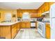 Functional kitchen features wooden cabinets, white appliances, and a practical layout for cooking and meal preparation at 6500 Wild Turkey Trl, Riverdale, GA 30296