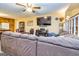 Comfortable living room with cozy seating, a built-in entertainment center, and view of the staircase at 6500 Wild Turkey Trl, Riverdale, GA 30296