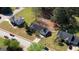 Aerial view of the home showcasing its well-manicured lawn, landscaping, and neighborhood setting at 50 Berkshire Pass, Covington, GA 30016