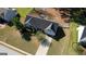Aerial view of a well-maintained home with a spacious driveway and beautiful landscaping in a peaceful neighborhood at 50 Berkshire Pass, Covington, GA 30016