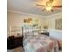 Cozy bedroom with ceiling fan, comfortable bed, and neutral decor for a relaxing atmosphere at 50 Berkshire Pass, Covington, GA 30016