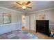 Bedroom with ceiling fan, half-wall wainscoting, and a spacious closet at 50 Berkshire Pass, Covington, GA 30016