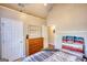 Bright bedroom featuring a vaulted ceiling and wood dresser at 50 Berkshire Pass, Covington, GA 30016