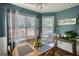 Dining area featuring natural lighting, neutral decor, and a view to the backyard at 50 Berkshire Pass, Covington, GA 30016