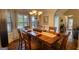 Elegant dining room with natural light and large wood table, great for entertaining at 50 Berkshire Pass, Covington, GA 30016