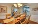 Dining room with wood table and chairs and a view to the living room and kitchen at 50 Berkshire Pass, Covington, GA 30016