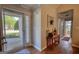 Inviting foyer with front door, tile flooring and a view into the main living space at 50 Berkshire Pass, Covington, GA 30016