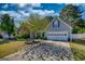 Charming home with a well-manicured lawn, mature tree and a two car garage at 50 Berkshire Pass, Covington, GA 30016