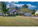 Well-maintained single story home with beautiful yard and attached two car garage at 50 Berkshire Pass, Covington, GA 30016