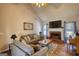 Cozy living room with vaulted ceilings, fireplace, hardwood flooring, and lots of natural light at 50 Berkshire Pass, Covington, GA 30016