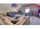 Finished attic with a large seating area and patriotic decor at 50 Berkshire Pass, Covington, GA 30016
