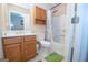 Cozy bathroom featuring a shower-tub combo, vanity with white countertop, and medicine cabinet for storage at 1346 Revelstoke Cv, Riverdale, GA 30296