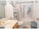 Charming bathroom showcasing a shower, white tiles, and a vanity with a traditional sink fixture at 1346 Revelstoke Cv, Riverdale, GA 30296