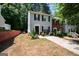 Charming two-story townhome featuring a well-maintained front yard and a private driveway at 1346 Revelstoke Cv, Riverdale, GA 30296