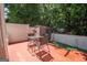 Outdoor patio offers a quiet space perfect for outdoor dining or relaxation surrounded by lush greenery at 1346 Revelstoke Cv, Riverdale, GA 30296