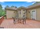 A wooden deck area featuring a table with chairs and an outside view at 226 Long Island Dr, Whitesburg, GA 30185