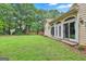 Beautiful backyard with lush greenery, offering a serene and private outdoor space at 226 Long Island Dr, Whitesburg, GA 30185