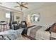 Bedroom features a ceiling fan, sitting area, and neutral color scheme at 226 Long Island Dr, Whitesburg, GA 30185
